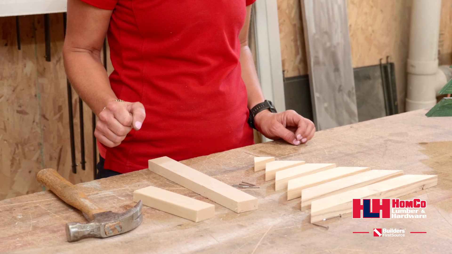 wooden planks organized on workbench in shape of christmas tree